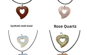 Macro view of heart-shaped stone pendants including Rose Quartz and Gold Sandstone