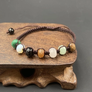 Handmade woven bracelet with seven natural colorful faceted crystal stones and adjustable cord