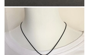 Minimalist black cord necklace on white t-shirt mannequin with long rectangular pendant