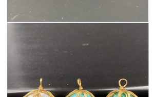 Detailed close-up of wire-wrapped semi-precious stone pendants in various natural colors
