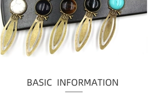 Detailed macro view of vintage bronze bookmarks with inlaid natural stone owl pendants
