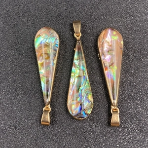 Water-drop shaped abalone shell pendants with golden metal trim and natural iridescence