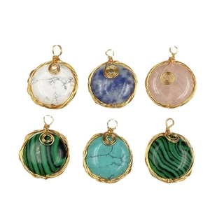 Set of six circular semi-precious stone pendants with handmade wire wrapping