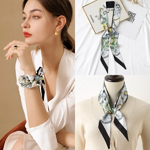 Floral print satin skinny scarf shown worn on wrist, neck, and as a bag accessory