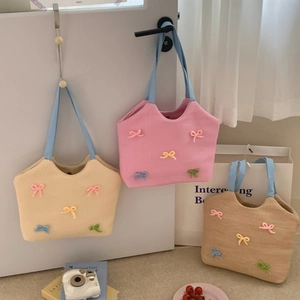 Summer beach woven tote bags with colorful knitted bows in beige pink and brown