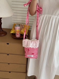 Pink and white checkered crossbody bag featuring sweet lace trim and a cute bow detail