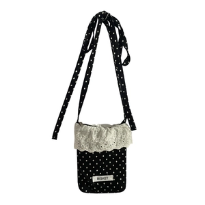 Crossbody phone bag with black polka dots, bow detail and white lace embroidery trim