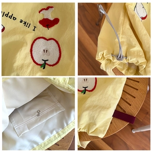 Bright yellow tote bag with apple embroidery and drawstring detail in a 4-grid detail view