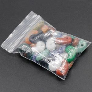 Mixed natural stone Magatama comma-shaped bead pendants in a clear protective polybag
