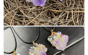 Close-up of wire-wrapped raw amethyst pendant with gold wire and pearl accents