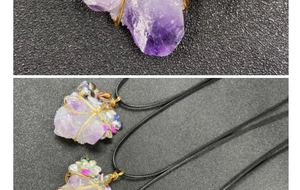 Detailed close-up of handmade wire-wrapped amethyst pendant with colorful stone accents