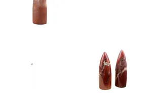 Polished red jasper stone obelisk point featuring natural white veins and textures