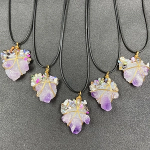 Irregular amethyst geode pendant necklace with wire wrapped details and pearl accents