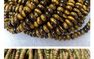 Detalle macro de cuentas naturales de Ojo de Tigre y Unakita con texturas pulidas