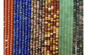 Detailed view of assorted natural stone abacus beads for DIY jewelry making and crafts
