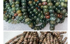 Detailed macro view of polished rondelle beads in green agate and pink rhodonite textures