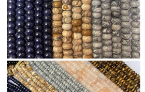 Primer plano de cuentas de ojo de tigre y piedras naturales pulidas para manualidades