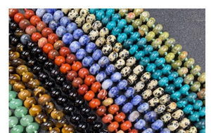 Macro detail of colorful natural stone rondelle beads showing natural mineral textures