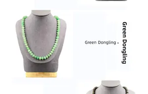 Macro detail of natural Green Dongling jade beads on a necklace displayed on a mannequin