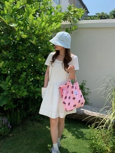 Pink textured puff canvas tote bag with black cat patterns and branded woven label