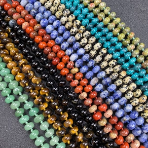Multiple rows of colorful natural stone abacus beads including tiger eye and agate