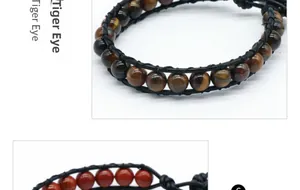 Vue détaillée de bracelets en cuir tressé avec perles d'œil de tigre et pierre rouge