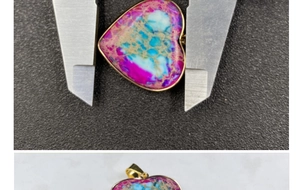 Detailed macro view showing the size measurement of the heart emperor stone pendant