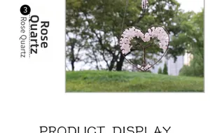 Close-up of rose quartz tree of life hanging ornament with wire heart frame