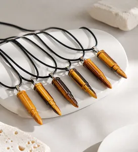 Detailed macro view of tiger eye stone bullet pendants with natural crystal texture