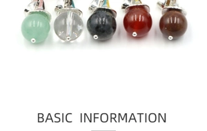 Detailed view of spherical natural crystal pendants in various gemstones with silver clasps