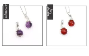Detailed comparison of polished round amethyst and red agate pendants with silver caps