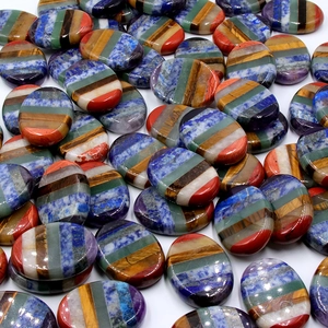 Set of oval 7 chakra natural stones with rainbow stripes for meditation and yoga healing