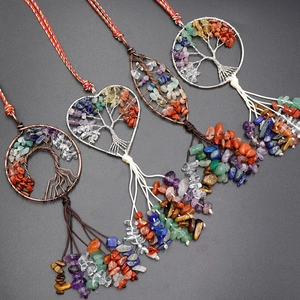 Tree of Life chakra pendants in heart and leaf shapes with natural colorful crystal tassels