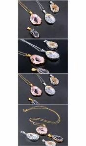 Detail of natural agate geode pendant necklace with gold plated edge and crystal druzy textures