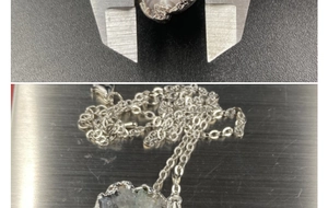 Macro shot measuring the natural agate geode pendant width with a digital caliper