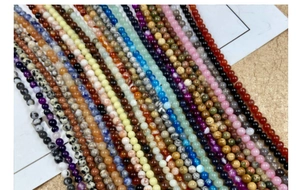 Macro shot of colorful 4mm natural stone beads strands for DIY jewelry making