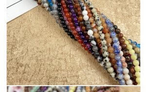 Macro view of 4mm assorted gemstone beads in various colors for DIY jewelry making