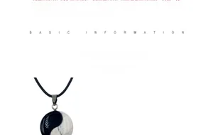 Macro detail of Tai Chi Yin Yang pendant showing natural and synthetic material textures