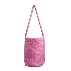 Plush pink faux fur bucket shoulder bag with soft texture for autumn and winter casual style