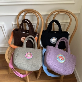 Detailed view of plush lamb wool tote bags in four colors with cute cartoon patches