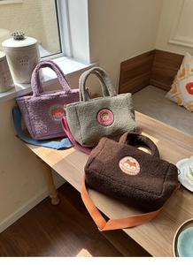 Three lamb wool tote bags in purple, green, and brown with cartoon patches and straps