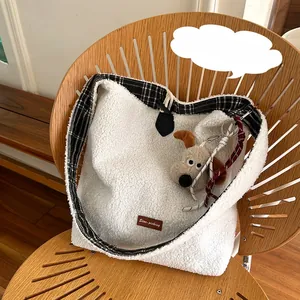Detail of white plush tote bag with checkered trim and Star-picking leather patch