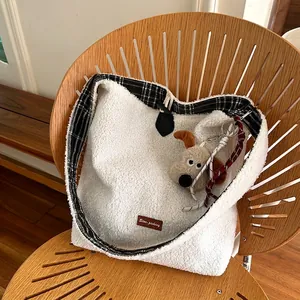 Minimalist plush white tote bag with black checkered trim and brown leather star-picking label