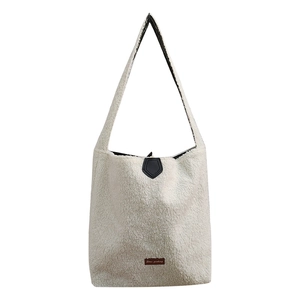 Minimalist white plush tote bag with shoulder strap for autumn commute styling