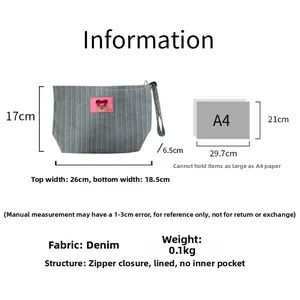 Detailed size chart for the striped denim cosmetic bag showing dimensions and hand strap