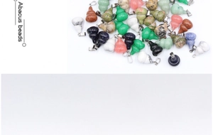 Detailed macro view of natural stone gourd pendants in diverse colors with silver clasps