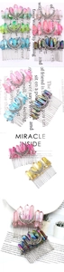 Detailed macro view of Wicca moon hair comb with raw colorful crystals and silver wire