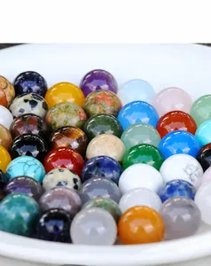 Macro shot of 8mm polished natural stone balls including amethyst and aventurine