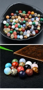 Macro view of assorted 8mm round natural aventurine and agate stones for DIY crafts