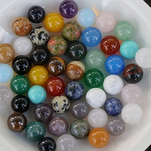 Polished 8mm natural gemstone beads in assorted minerals like aventurine and quartz in a bowl